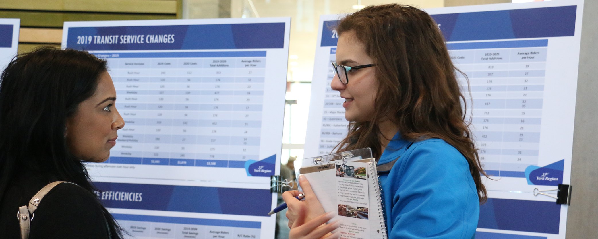 Photo of a Service Planner speaking with residents at the Public Engagement Forum event.