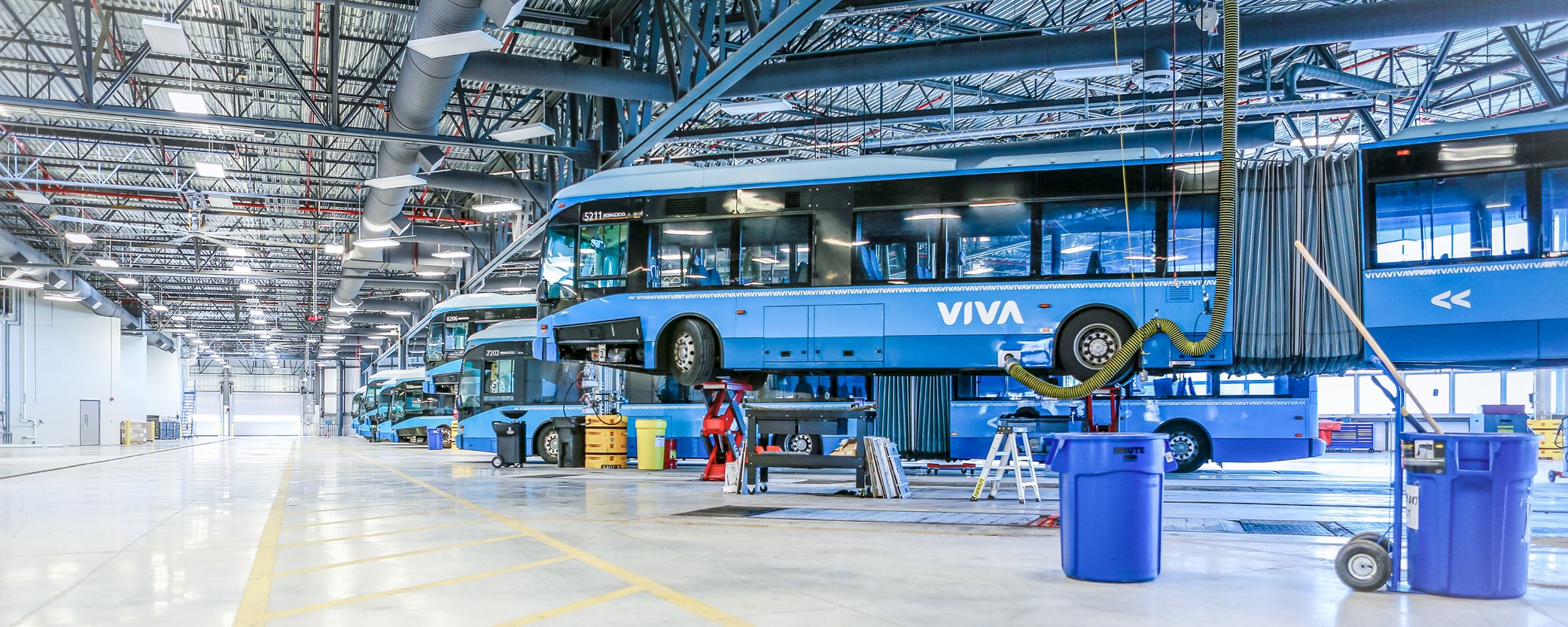 Photo of the YRT bus depot with rows of Viva buses.