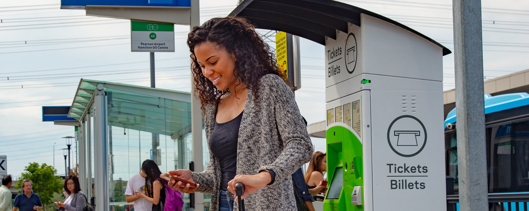 Photo of a woman waiting for a GO bus