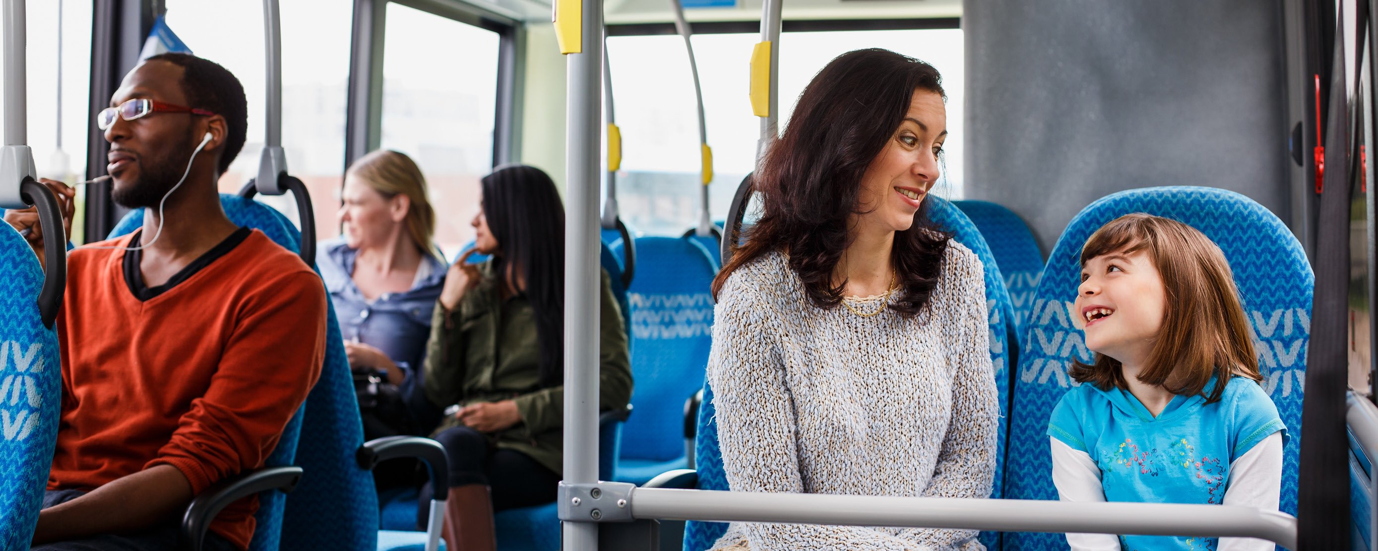 Mother and child riding a Viva bus with other passengers