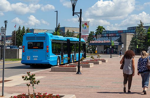 image of a theatre building with a blue Viva bus near front entrance