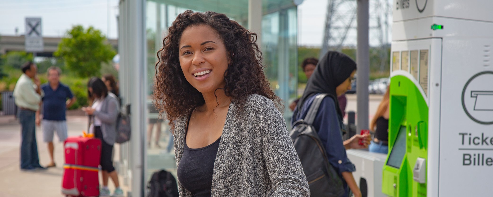 Image Banner of a young woman waiting for bus at terminal