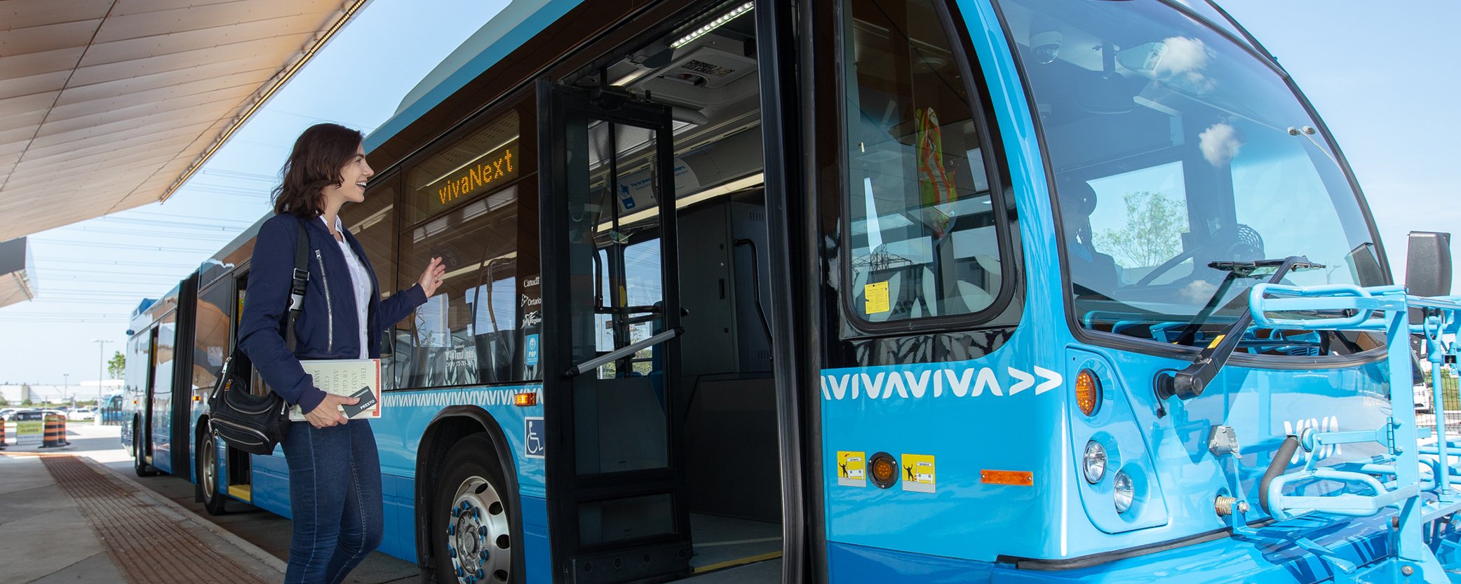 Image Banner of Young woman boarding a bus