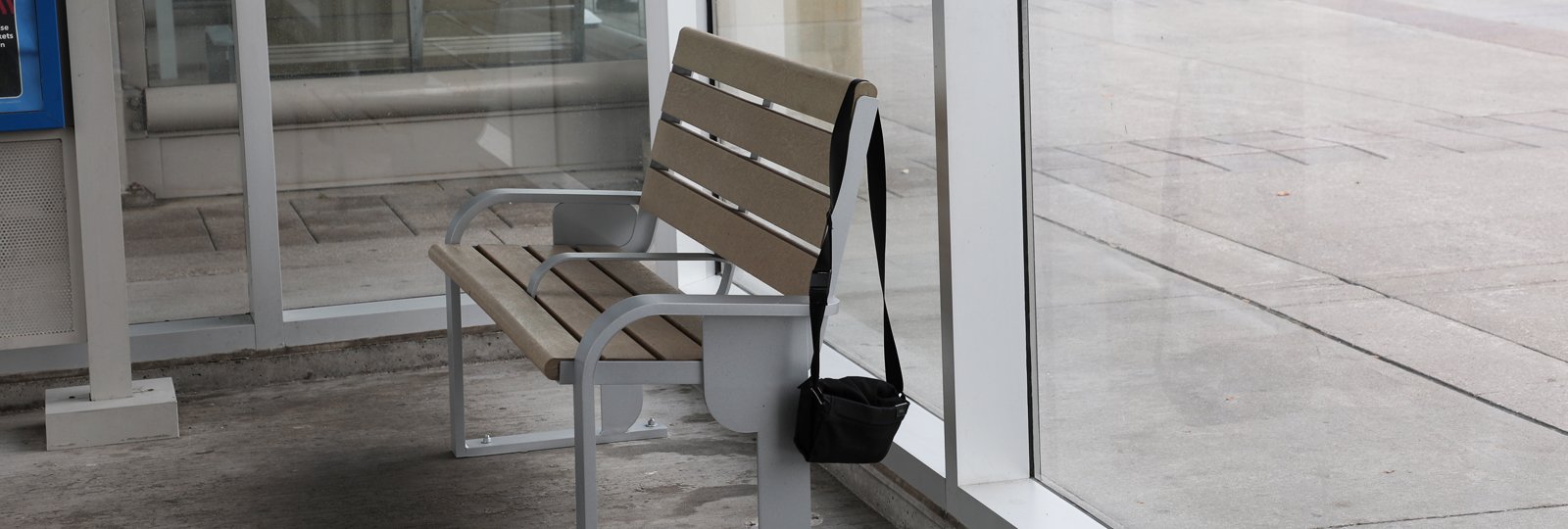 Report a Lost Item by Phone Page Banner a bag hanging on a bench