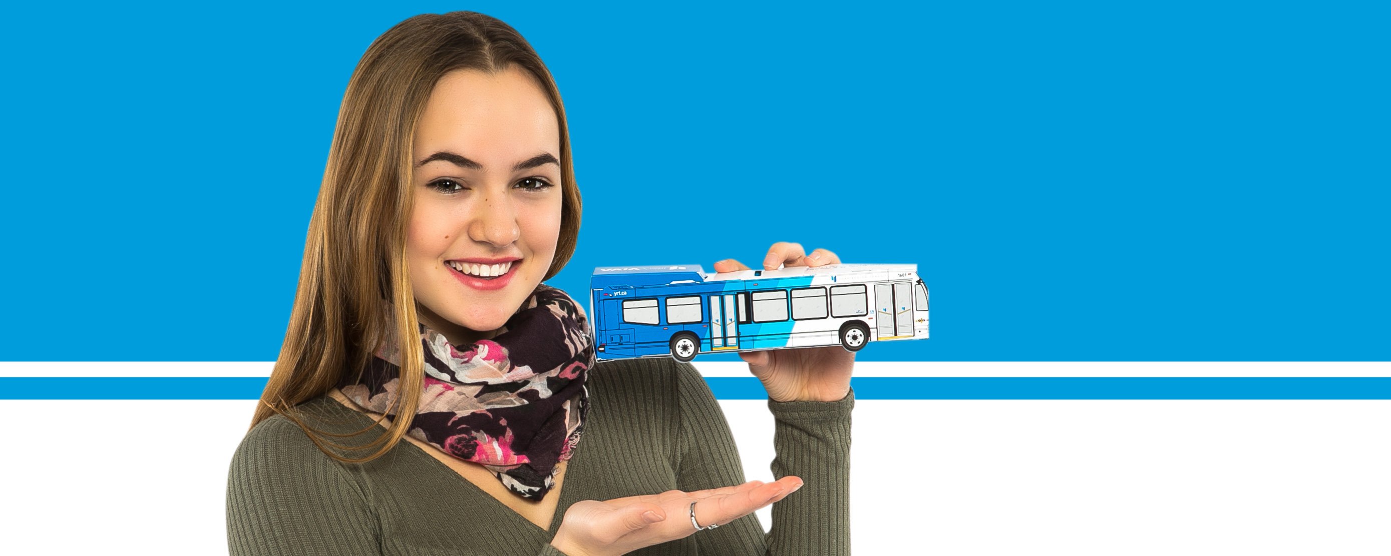 image of a female student holding a paper YRT bus